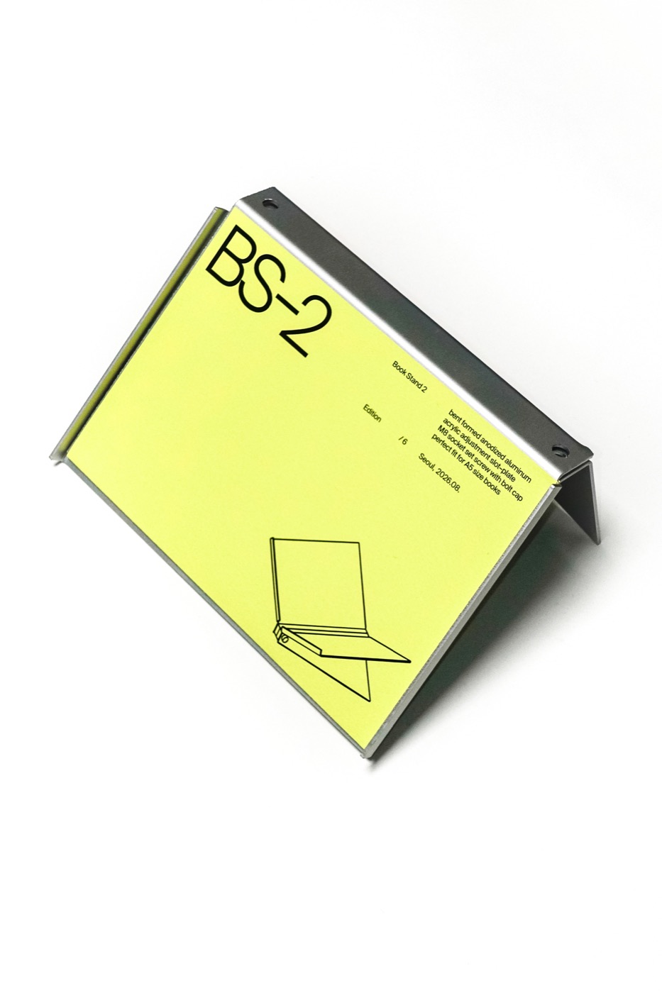 The stand holding its own printed sheet, tilted